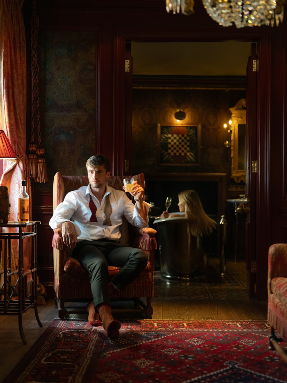 Luxurious suite at The Witchery with ornate furnishings and warm ambient lighting