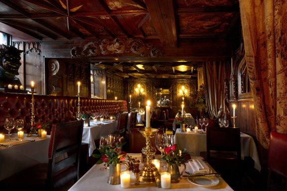 Wide shot of restaurant showing red and gold decor