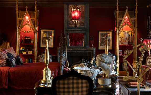 The Old Rectory Suite with rich textiles and antique elegance.